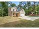 Charming two-story home with a well-manicured lawn and a convenient attached garage at 3902 Bouldercrest Se Rd, Ellenwood, GA 30294
