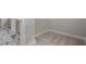 Hallway with carpet and tile floors, and views into the bathroom at 3902 Bouldercrest Se Rd, Ellenwood, GA 30294