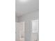Hallway with doorways that lead to rooms with gray walls at 3902 Bouldercrest Se Rd, Ellenwood, GA 30294
