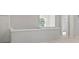 Upstairs hallway features gray walls, white trim, and a chandelier at 3902 Bouldercrest Se Rd, Ellenwood, GA 30294