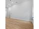 Minimalist living room showcasing hardwood floors, neutral paint, and large windows at 3902 Bouldercrest Se Rd, Ellenwood, GA 30294