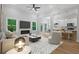 Bright and airy living room featuring a fireplace, hardwood floors, and an open floor plan at 3902 Bouldercrest Se Rd, Ellenwood, GA 30294