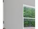 The new construction home offers a view of trees through the window at 3902 Bouldercrest Se Rd, Ellenwood, GA 30294