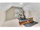 Bonus room with exercise equipment, a window, and neutral wall colors at 1107 Carroll Ct, Norcross, GA 30071