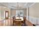 Formal dining room with a tray ceiling, chandelier, and natural light at 1107 Carroll Ct, Norcross, GA 30071