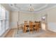 A traditional dining room with hardwood floors, a chandelier and natural light at 1107 Carroll Ct, Norcross, GA 30071