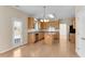 Bright eat-in kitchen boasts stainless appliances, wood cabinets, and hardwood floors at 1107 Carroll Ct, Norcross, GA 30071