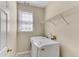 Functional laundry room equipped with modern appliances and wire shelving at 1107 Carroll Ct, Norcross, GA 30071