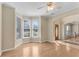 Bright living room featuring beautiful hardwood floors, large windows, and neutral wall colors at 1107 Carroll Ct, Norcross, GA 30071