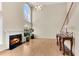 Living room features a fireplace, large windows, and hardwood floors at 1107 Carroll Ct, Norcross, GA 30071