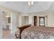 Main bedroom with tray ceiling showing bath and closet access at 1107 Carroll Ct, Norcross, GA 30071