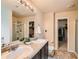 Primary bathroom boasts double sinks, a large mirror, a walk-in shower, and a walk-in closet at 1262 Brookstone Cir, Conyers, GA 30012
