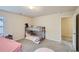 Bedroom featuring a bunk bed, a pink tent, carpeted floors, and a window for natural light at 1262 Brookstone Cir, Conyers, GA 30012