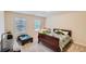 Bedroom with two windows, a bed, and a play area with carpeted flooring at 1262 Brookstone Cir, Conyers, GA 30012