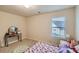 Cozy bedroom featuring natural light from the window and neutral-toned walls at 1262 Brookstone Cir, Conyers, GA 30012