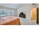 Bright bedroom features a bed, bureau, and three windows that allow ample natural light into the room at 1262 Brookstone Cir, Conyers, GA 30012