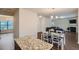 Open-concept kitchen featuring granite countertops, a central island, and a view into the living room with fireplace at 1262 Brookstone Cir, Conyers, GA 30012