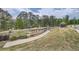 Community playground featuring walking paths, a lake, and plenty of seating at 1262 Brookstone Cir, Conyers, GA 30012