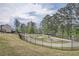 Community playground featuring play equipment, seating and walking trail with mature trees at 1262 Brookstone Cir, Conyers, GA 30012