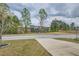 Street view looking at a lake and a street with a tree at 1262 Brookstone Cir, Conyers, GA 30012