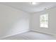 Bedroom offers plush carpeting and a bright window view at 213 Admor Ln, Acworth, GA 30102