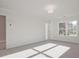 Bedroom with carpet flooring and natural light streaming from the window at 213 Admor Ln, Acworth, GA 30102