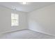 Cozy carpeted bedroom with a window letting in natural light at 213 Admor Ln, Acworth, GA 30102