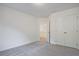 An empty bedroom with carpet and a closet provides ample space for personalization at 213 Admor Ln, Acworth, GA 30102