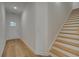 Bright entryway with hardwood floors features a staircase and access to the rest of the house at 213 Admor Ln, Acworth, GA 30102