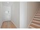 Inviting entryway featuring hardwood floors, a staircase, and a bright, welcoming atmosphere at 213 Admor Ln, Acworth, GA 30102