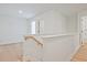 Hallway features neutral decor, wood floors, and white stairs at 213 Admor Ln, Acworth, GA 30102