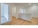 Upstairs hallway with wooden floors and natural light is newly renovated at 213 Admor Ln, Acworth, GA 30102