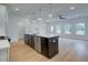Modern kitchen with a large island, stainless steel appliances, and an open floor plan at 213 Admor Ln, Acworth, GA 30102