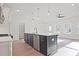 Bright, open kitchen featuring a large island, stainless steel appliances, and hardwood floors at 213 Admor Ln, Acworth, GA 30102