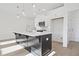 Island kitchen with stainless steel appliances, white cabinets, and a modern faucet at 213 Admor Ln, Acworth, GA 30102