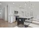 Modern kitchen with a large island, stainless steel appliances, and stylish pendant lighting at 213 Admor Ln, Acworth, GA 30102