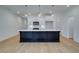 Modern kitchen featuring a large island with pendant lighting and white cabinets at 213 Admor Ln, Acworth, GA 30102