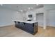 Modern kitchen showcasing a large island and stainless steel appliances at 213 Admor Ln, Acworth, GA 30102