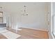 Spacious living area with hardwood floors, open layout, and modern light fixtures at 213 Admor Ln, Acworth, GA 30102