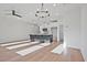 Open-concept living and kitchen area with hardwood floors, island, and stainless steel appliances at 213 Admor Ln, Acworth, GA 30102