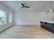 Bright living room with large windows and hardwood floors, adjacent to the kitchen at 213 Admor Ln, Acworth, GA 30102
