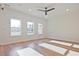 Sun-filled living room with hardwood floors, recessed lighting, and large windows overlooking the yard at 213 Admor Ln, Acworth, GA 30102