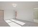 Spacious carpeted primary bedroom bathed in light, leading to a bathroom at 213 Admor Ln, Acworth, GA 30102