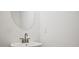 Bright powder room features a modern sink, faucet, and an oval mirror at 213 Admor Ln, Acworth, GA 30102