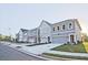New townhomes boast varied exterior designs, attached garages, and attractively landscaped front yards at 213 Admor Ln, Acworth, GA 30102
