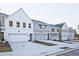 Street view of townhomes with attached garages and manicured lawns at 213 Admor Ln, Acworth, GA 30102
