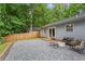 Cozy backyard area with pea gravel, a fire pit, and comfortable seating near the home at 2565 Bates Se St, Smyrna, GA 30080