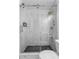 Bathroom featuring glass shower with gold hardware and black tile floor at 2565 Bates Se St, Smyrna, GA 30080