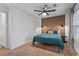 Bedroom with modern accent wall, ceiling fan, and bright natural light at 2565 Bates Se St, Smyrna, GA 30080