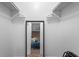 Walk-in closet leading to bedroom with accent wall at 2565 Bates Se St, Smyrna, GA 30080